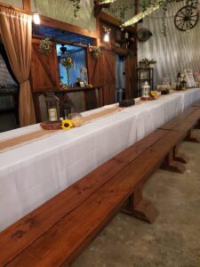 A table set up in a barn.